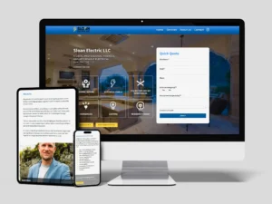 Computer and smartphone displaying the Sloan Electric LLC website, featuring service options and a contact form for quick quotes.